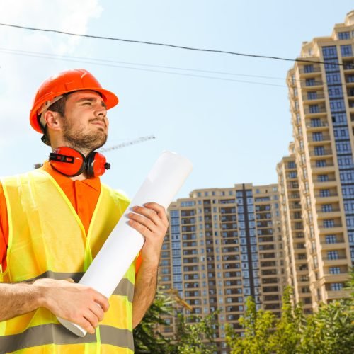 Young man civil engineer in safety hat